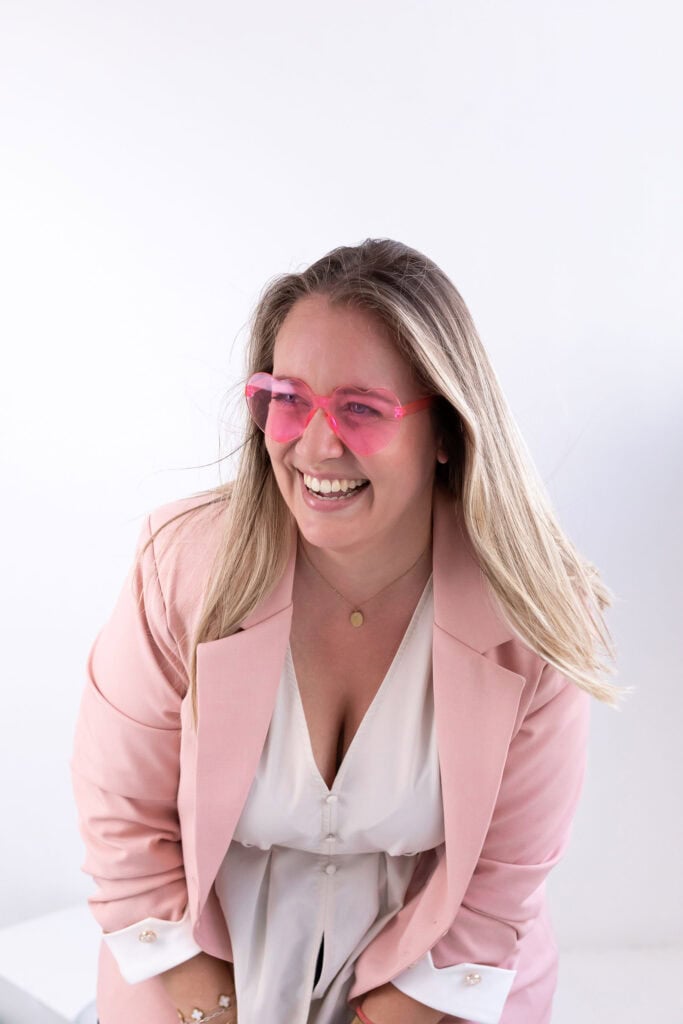 Hot Shot Events team member smiling in a pink blazer